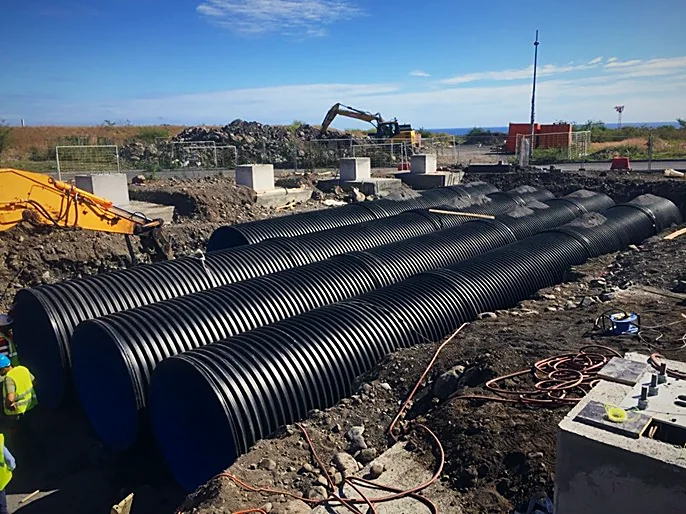 Laying HDPE pipes for a retention basin
